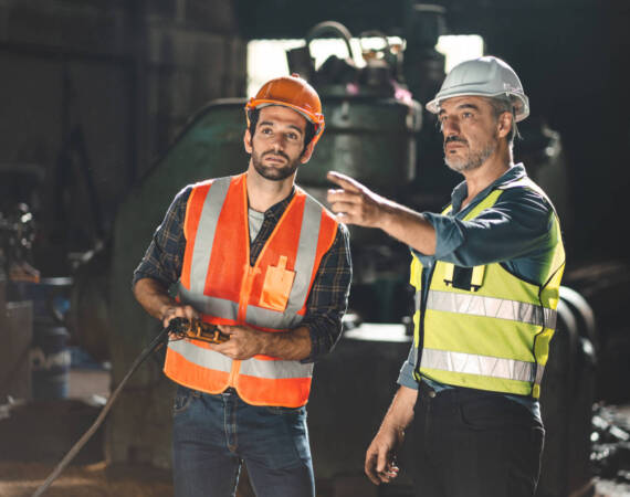 professional technician engineer with safety working in industrial manufacturing factory